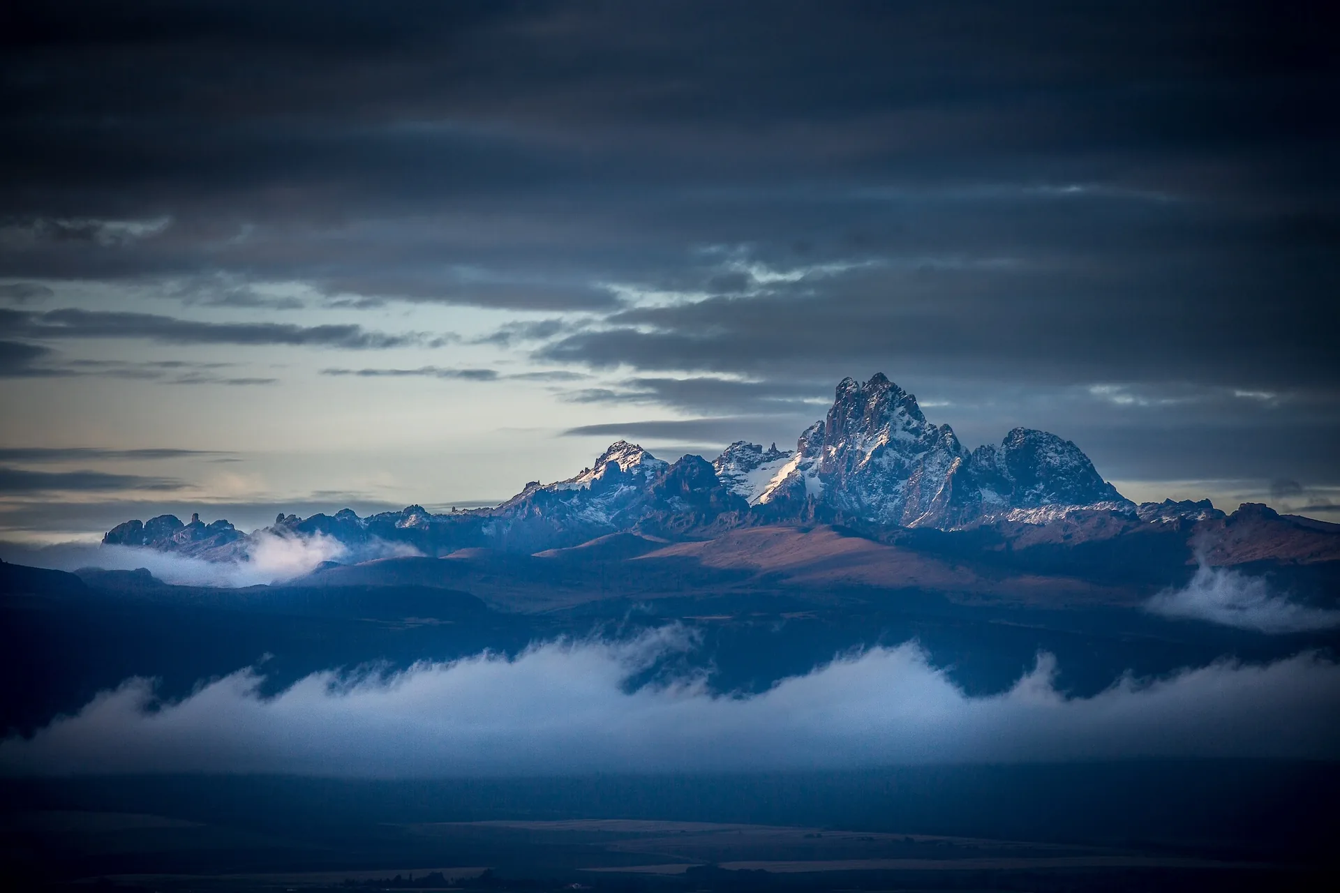 Mount Kenya at sunrise, golden light on the peak